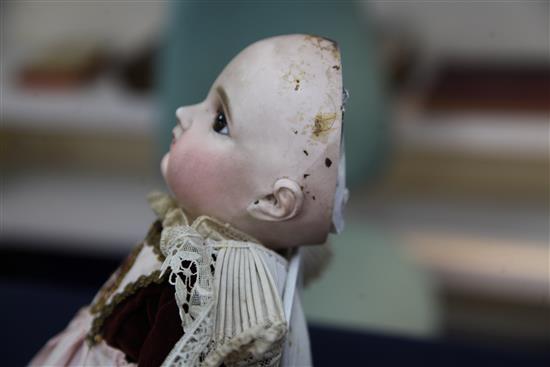 A Jumeau bisque head doll, stamped 7EJ, late 19th century, height 17.5in., small firing crack to right ear